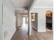 View of the Living Room with wood floors, neutral paint and an archway leading to the kitchen at 202 Nathan Sw Rd, Atlanta, GA 30331