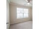 Bright bedroom featuring neutral walls and a large window at 2453 Suwanee Pointe Dr, Lawrenceville, GA 30043