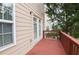 Cozy outdoor deck made of wood attached to the house exterior at 2453 Suwanee Pointe Dr, Lawrenceville, GA 30043