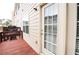 Wooden deck area with sliding glass doors and ample natural light at 2453 Suwanee Pointe Dr, Lawrenceville, GA 30043