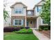 Charming home featuring a stone facade and a well-manicured lawn with lush landscaping at 2453 Suwanee Pointe Dr, Lawrenceville, GA 30043