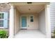Inviting covered front porch offering ample space and a welcoming entrance at 2453 Suwanee Pointe Dr, Lawrenceville, GA 30043