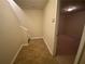 Hallway with tile flooring leading to a finished basement or bonus room at 2453 Suwanee Pointe Dr, Lawrenceville, GA 30043