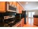 Well-equipped kitchen featuring stainless steel appliances and dark countertops at 2453 Suwanee Pointe Dr, Lawrenceville, GA 30043