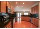 Well-equipped kitchen featuring stainless steel appliances and dark countertops at 2453 Suwanee Pointe Dr, Lawrenceville, GA 30043