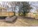 Backyard featuring a new wooden deck, green trees, and a view of the natural surroundings at 2973 Cambridge Sw Dr, Atlanta, GA 30331