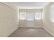 Spacious room featuring an exterior door and plenty of natural light at 2973 Cambridge Sw Dr, Atlanta, GA 30331