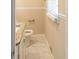 Bright bathroom featuring a granite countertop vanity, tile floor, and plenty of light at 2973 Cambridge Sw Dr, Atlanta, GA 30331