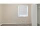 Carpeted bedroom with a closet, neutral walls, and a window at 2973 Cambridge Sw Dr, Atlanta, GA 30331