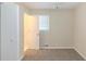 This bedroom is carpeted and has a closet and a window at 2973 Cambridge Sw Dr, Atlanta, GA 30331