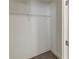 A small closet with one wire shelf and a carpeted floor, ready to be used at 2973 Cambridge Sw Dr, Atlanta, GA 30331
