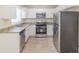 Modern kitchen with stainless steel appliances, granite countertops, and sleek white cabinetry at 2973 Cambridge Sw Dr, Atlanta, GA 30331
