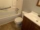 Bathroom featuring a tub/shower combo, toilet, and sink with vanity at 8229 Queens Dr, Jonesboro, GA 30238