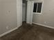 This cozy bedroom has carpet, a built-in closet, and ample lighting at 8229 Queens Dr, Jonesboro, GA 30238