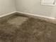Bedroom with plush carpeting and neutral gray paint at 8229 Queens Dr, Jonesboro, GA 30238