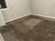 Bedroom featuring clean carpets, fresh paint, and ample lighting at 8229 Queens Dr, Jonesboro, GA 30238