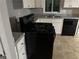 Well-equipped kitchen featuring a stove and dishwasher, and ample counter space at 8229 Queens Dr, Jonesboro, GA 30238