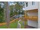 Landscaped backyard with a gravel path, and white picket fence, offering privacy at 830 Gaston Street Sw, Atlanta, GA 30310