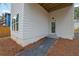 Side view of home with a gravel path leading to a door, mulch, and the home's exterior at 830 Gaston Street Sw, Atlanta, GA 30310