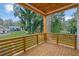 The wooden balcony provides a relaxing outdoor space with views of the tree-filled neighborhood at 830 Gaston Street Sw, Atlanta, GA 30310