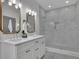 Elegant bathroom featuring double sinks, a spacious walk-in shower, and stylish grey tile at 830 Gaston Street Sw, Atlanta, GA 30310