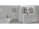 This well-lit bathroom features double sinks, chrome fixtures, a soaking tub, and walk-in shower at 830 Gaston Street Sw, Atlanta, GA 30310