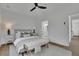 Relaxing bedroom showcasing a neutral color palette, white plank wall and an adjoining bathroom for convenience at 830 Gaston Street Sw, Atlanta, GA 30310