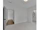 Empty room with neutral carpet, and access to both the bathroom and entryway for convenience at 830 Gaston Street Sw, Atlanta, GA 30310