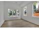 Bright room featuring hardwood floors, natural light from two windows, and neutral tones at 830 Gaston Street Sw, Atlanta, GA 30310
