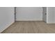 Empty room featuring hardwood floors, white walls, and bright lighting at 830 Gaston Street Sw, Atlanta, GA 30310