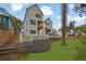 Beautiful two-story home featuring a manicured lawn, fenced yard, and multiple balconies at 830 Gaston Street Sw, Atlanta, GA 30310