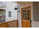 Inviting front door with a black iron address plate, gooseneck light, and wood accents at 830 Gaston Street Sw, Atlanta, GA 30310