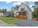 Beautiful new home with a charming wood porch in a suburban neighborhood at 830 Gaston Street Sw, Atlanta, GA 30310