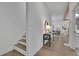 Hallway with hardwood floors and a view of the dining area, kitchen, and staircase at 830 Gaston Street Sw, Atlanta, GA 30310