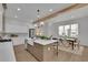 Bright and spacious kitchen with stainless appliances, farmhouse sink, and a breakfast area with large windows at 830 Gaston Street Sw, Atlanta, GA 30310