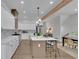 Modern kitchen featuring an eat-in island, stainless steel appliances, and a breakfast area with natural lighting at 830 Gaston Street Sw, Atlanta, GA 30310
