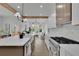 Open-concept kitchen with an eat-in island, stainless steel appliances, and ample counter space at 830 Gaston Street Sw, Atlanta, GA 30310