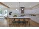 Spacious open concept kitchen with seating at the island bar and stainless appliances at 830 Gaston Street Sw, Atlanta, GA 30310