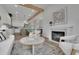 Bright living room with hardwood floors, a modern fireplace, and comfortable seating at 830 Gaston Street Sw, Atlanta, GA 30310