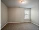 Bedroom with neutral walls, carpet flooring and window with natural light at 2154 Dodson Woods Dr, Fairburn, GA 30213
