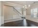 Elegant foyer with hardwood floors, stairs, and a chandelier at 2154 Dodson Woods Dr, Fairburn, GA 30213