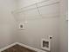 Laundry room with laminate flooring and wire shelving at 2154 Dodson Woods Dr, Fairburn, GA 30213