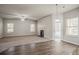 Bright living room with a fireplace, neutral carpet, and lots of natural light at 2154 Dodson Woods Dr, Fairburn, GA 30213