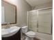 Bathroom featuring a vanity, toilet, and shower with glass doors at 3564 Sage Dr, Lithia Springs, GA 30122