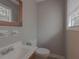 Bathroom featuring a vanity, toilet, and a window at 3564 Sage Dr, Lithia Springs, GA 30122