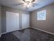Bedroom with two closets, neutral walls, carpet flooring, ceiling fan and a window at 3564 Sage Dr, Lithia Springs, GA 30122