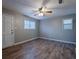 Inviting bedroom with ceiling fan, wood-look floors, and bright, neutral paint at 3564 Sage Dr, Lithia Springs, GA 30122