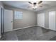 Bedroom with two closets, neutral walls, carpet flooring, ceiling fan and a window at 3564 Sage Dr, Lithia Springs, GA 30122