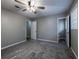 Bedroom with neutral walls, carpet flooring, ceiling fan, a door to the bathroom and a closet at 3564 Sage Dr, Lithia Springs, GA 30122