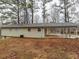 Rear exterior view of the home with a covered carport at 3564 Sage Dr, Lithia Springs, GA 30122